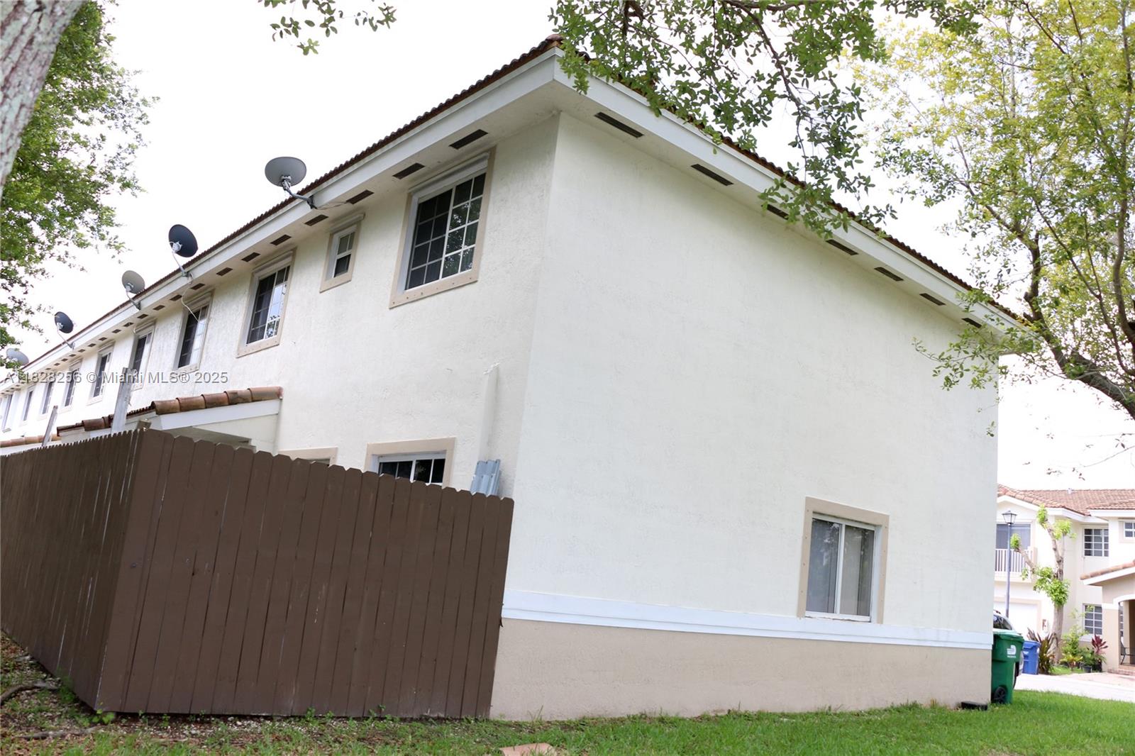 13990 Southwest 260th Street, Unit 101 Homestead, FL 33032 - Photo 31 of 34 a view of a house with a yard