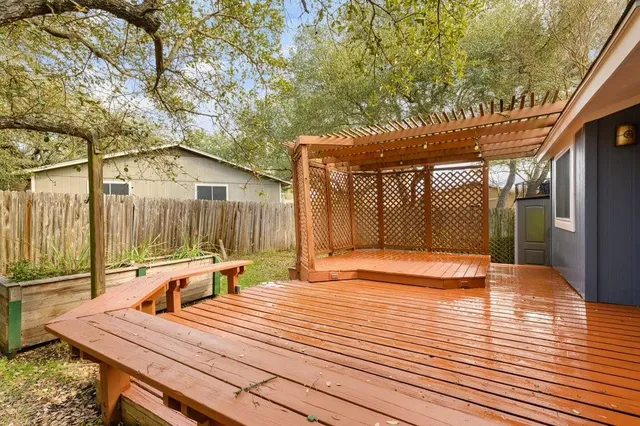 a backyard of a house with table and chairs