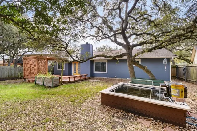 a house that has a tree in front of it