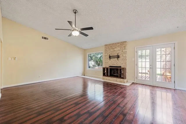 a view of a livingroom with wooden floor