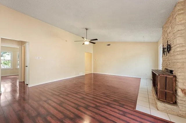 a kitchen with stainless steel appliances a stove top oven a sink and a refrigerator