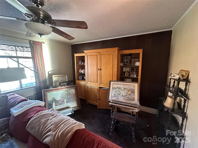 a bedroom with furniture and a window