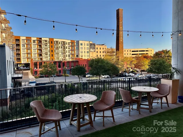 a view of a chairs and table in patio