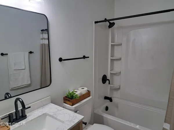 a bathroom with a sink and a shower