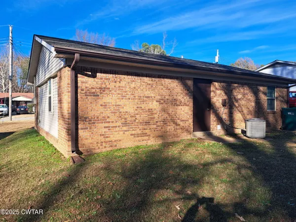 a view of a back yard from a big room