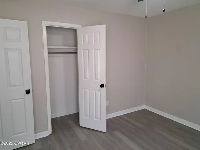 a view of a livingroom with wooden floor