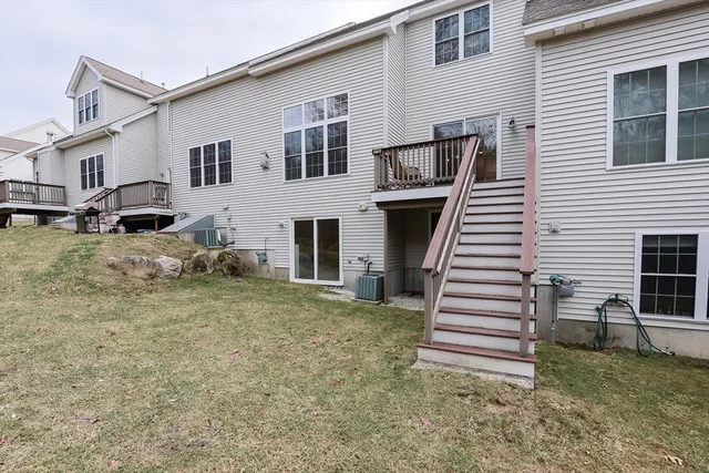a view of a balcony with furniture and front door