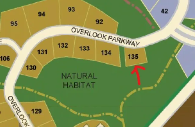 a view of a backyard with sitting area