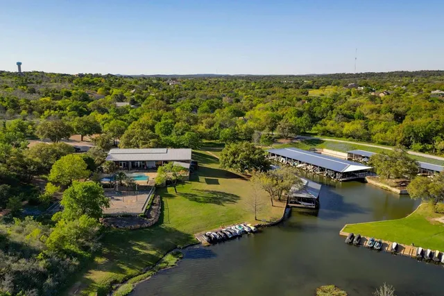 an aerial view of a house with a yard