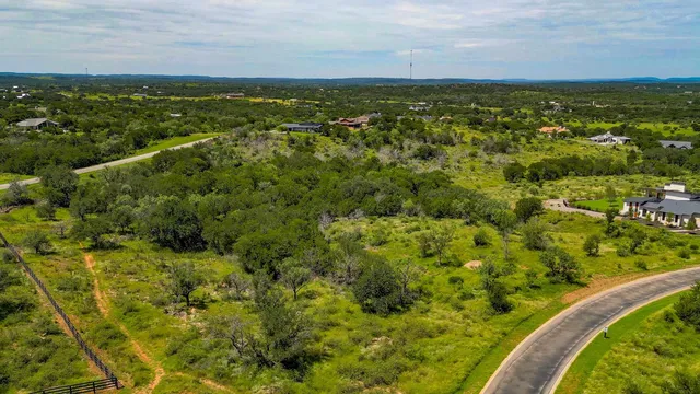 a view of a field with an ocean