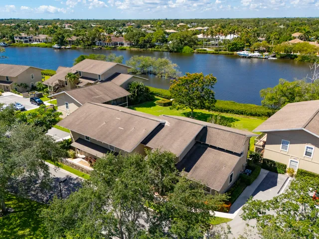 an aerial view of a house with a lake view