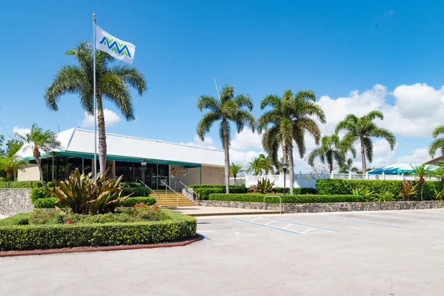 a view of a swimming pool with chairs