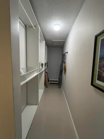 a living room with a balcony furniture and a flat screen tv