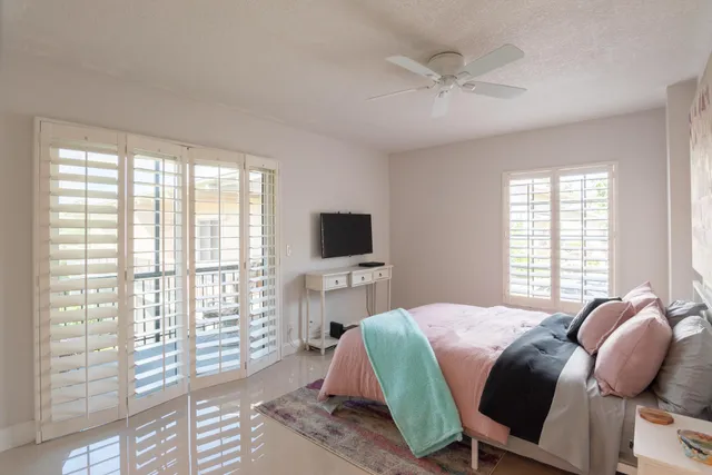 a bathroom with a toilet sink and shower