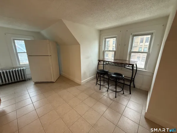 a view of workspace with furniture and window