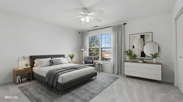 a bedroom with a bed a chandelier and dresser