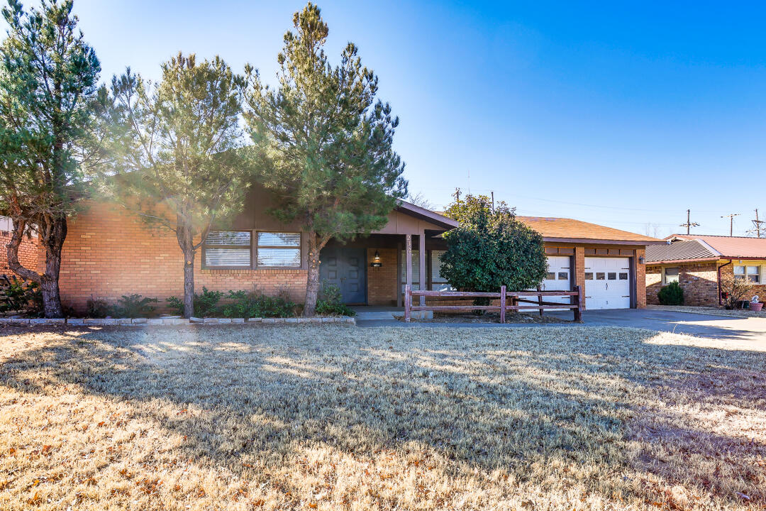 2123 66th Street Lubbock, TX 79412 - Photo 2 of 16 a view of a house with a yard