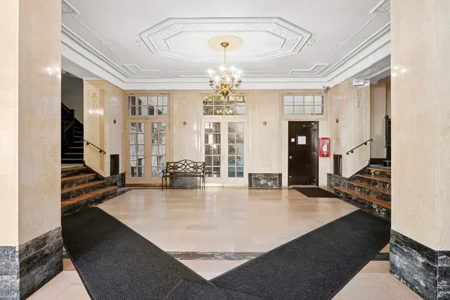 a view of a dining room with furniture and window