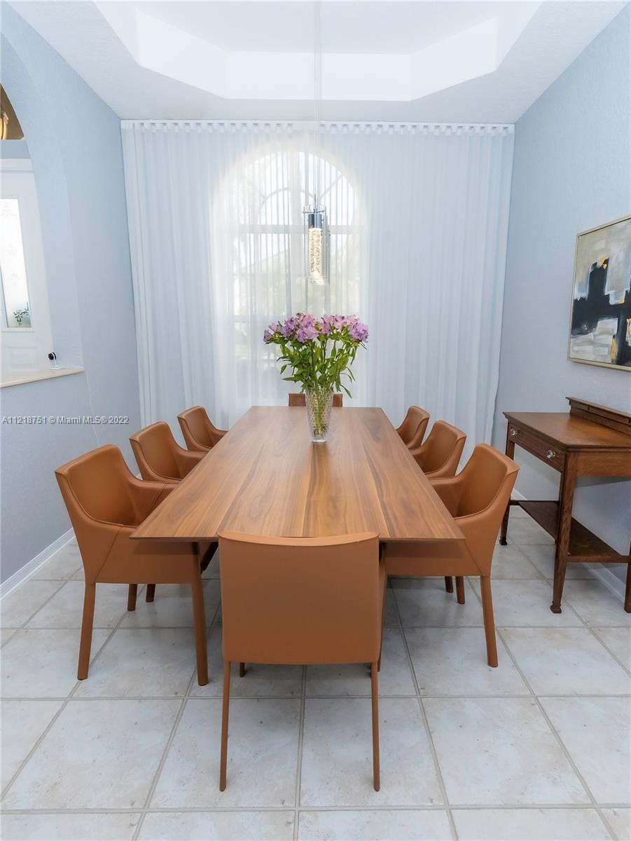 21432 Gosier Way Boca Raton, FL 33428 - Photo 11 of 55 a dining room with furniture and window
