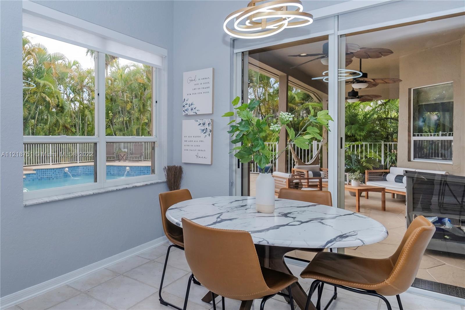 21432 Gosier Way Boca Raton, FL 33428 - Photo 17 of 55 a view of a dining room with furniture window and outside view