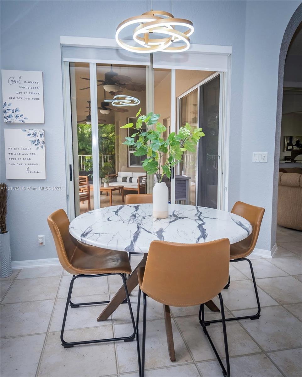 21432 Gosier Way Boca Raton, FL 33428 - Photo 18 of 55 a view of a dining room with furniture window and outside view