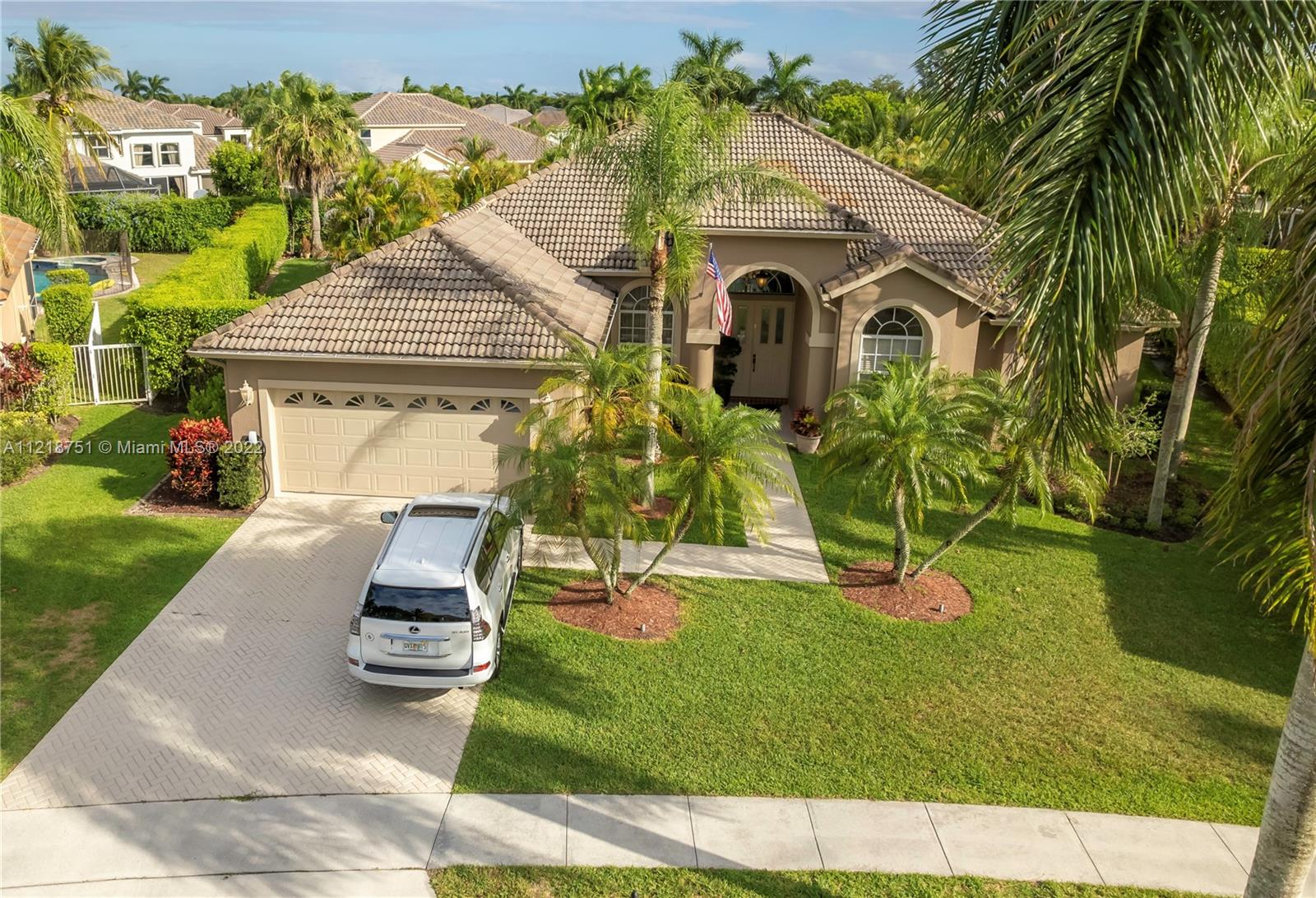 21432 Gosier Way Boca Raton, FL 33428 - Photo 2 of 55 a view of house with garden space and swimming pool