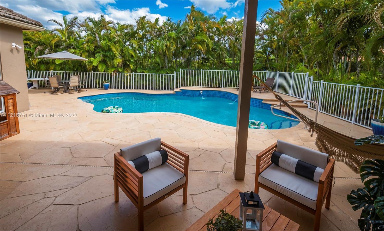 21432 Gosier Way Boca Raton, FL 33428 - Photo 21 of 55 a view of a backyard with swimming pool