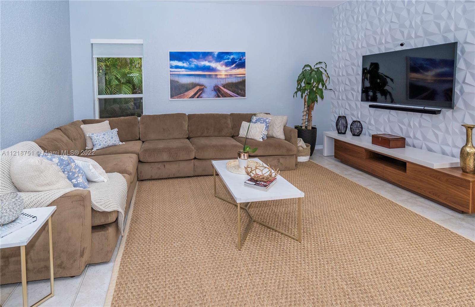 21432 Gosier Way Boca Raton, FL 33428 - Photo 22 of 55 a living room with furniture and a flat screen tv