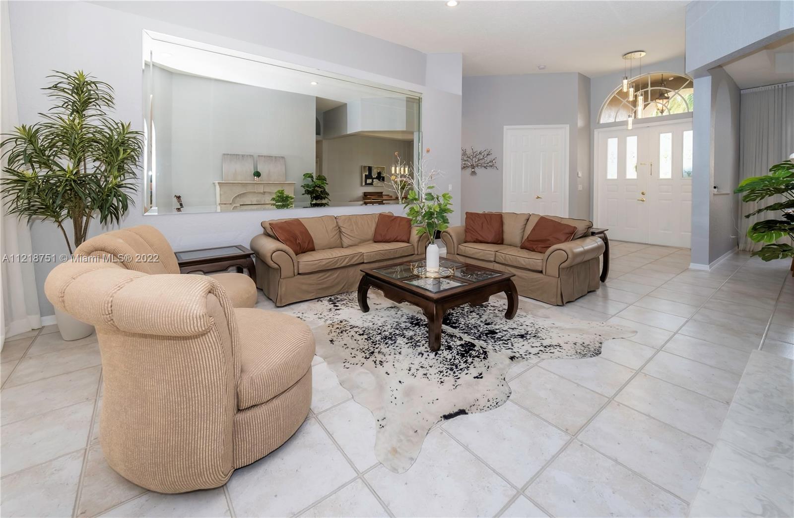 21432 Gosier Way Boca Raton, FL 33428 - Photo 25 of 55 a living room with furniture and a potted plant