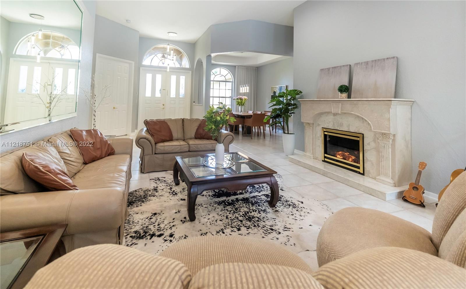 21432 Gosier Way Boca Raton, FL 33428 - Photo 27 of 55 a living room with furniture fireplace and window