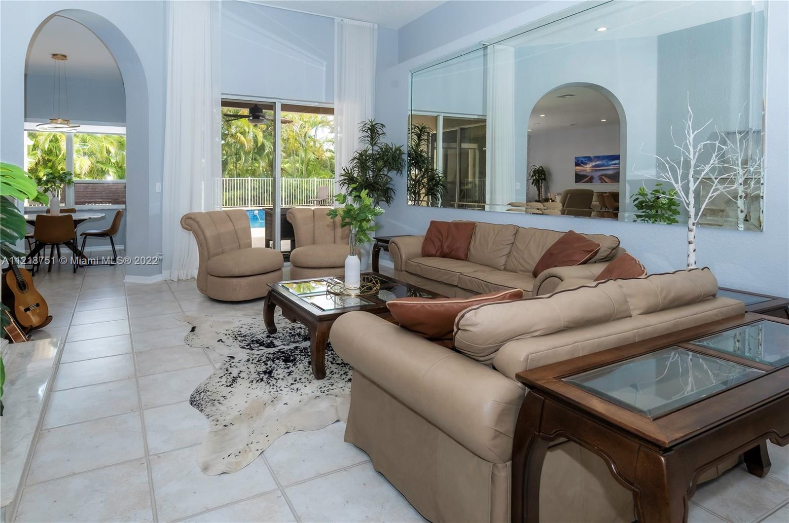 21432 Gosier Way Boca Raton, FL 33428 - Photo 30 of 55 a living room with furniture and a large window