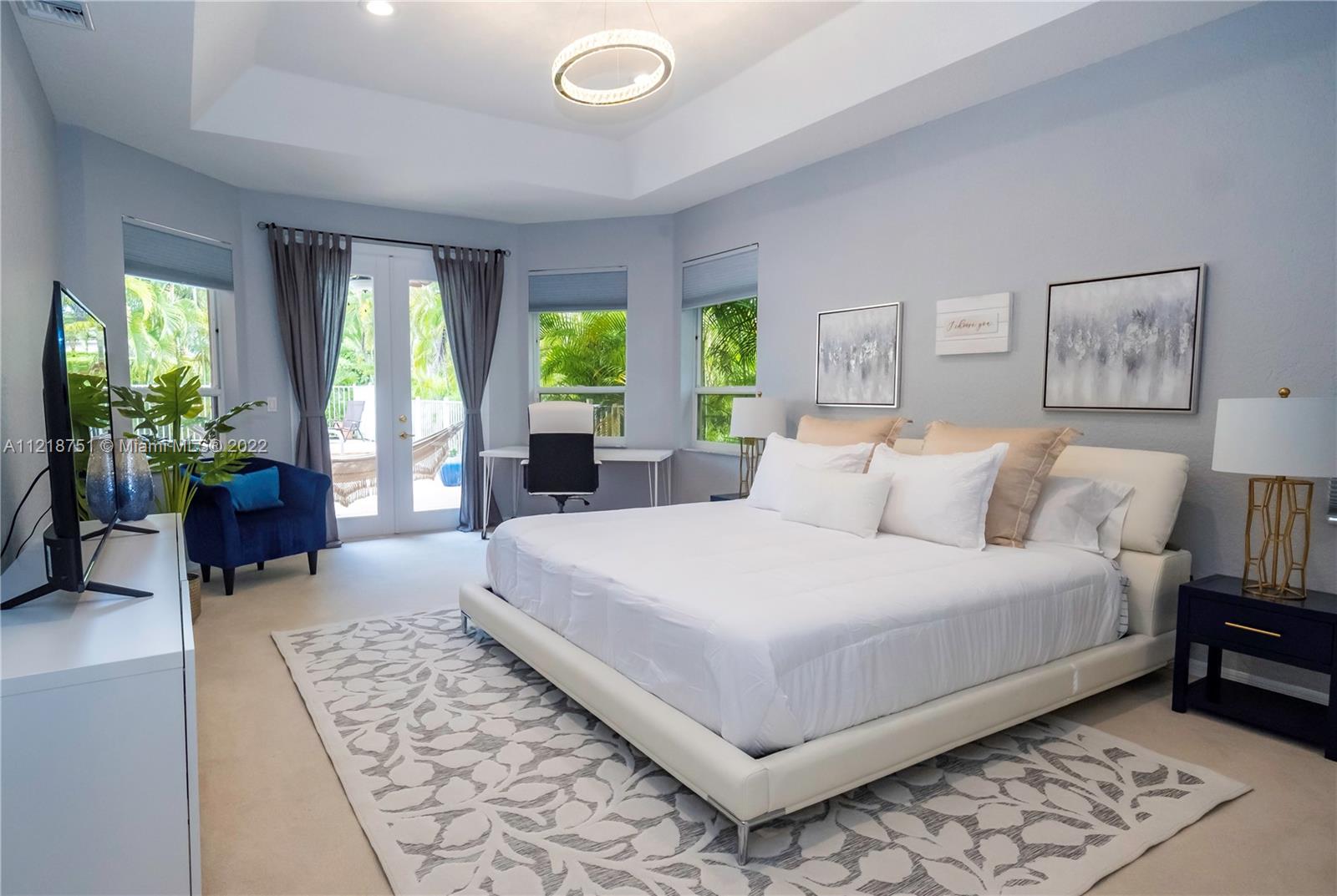21432 Gosier Way Boca Raton, FL 33428 - Photo 32 of 55 a large bedroom with a bed and a couch