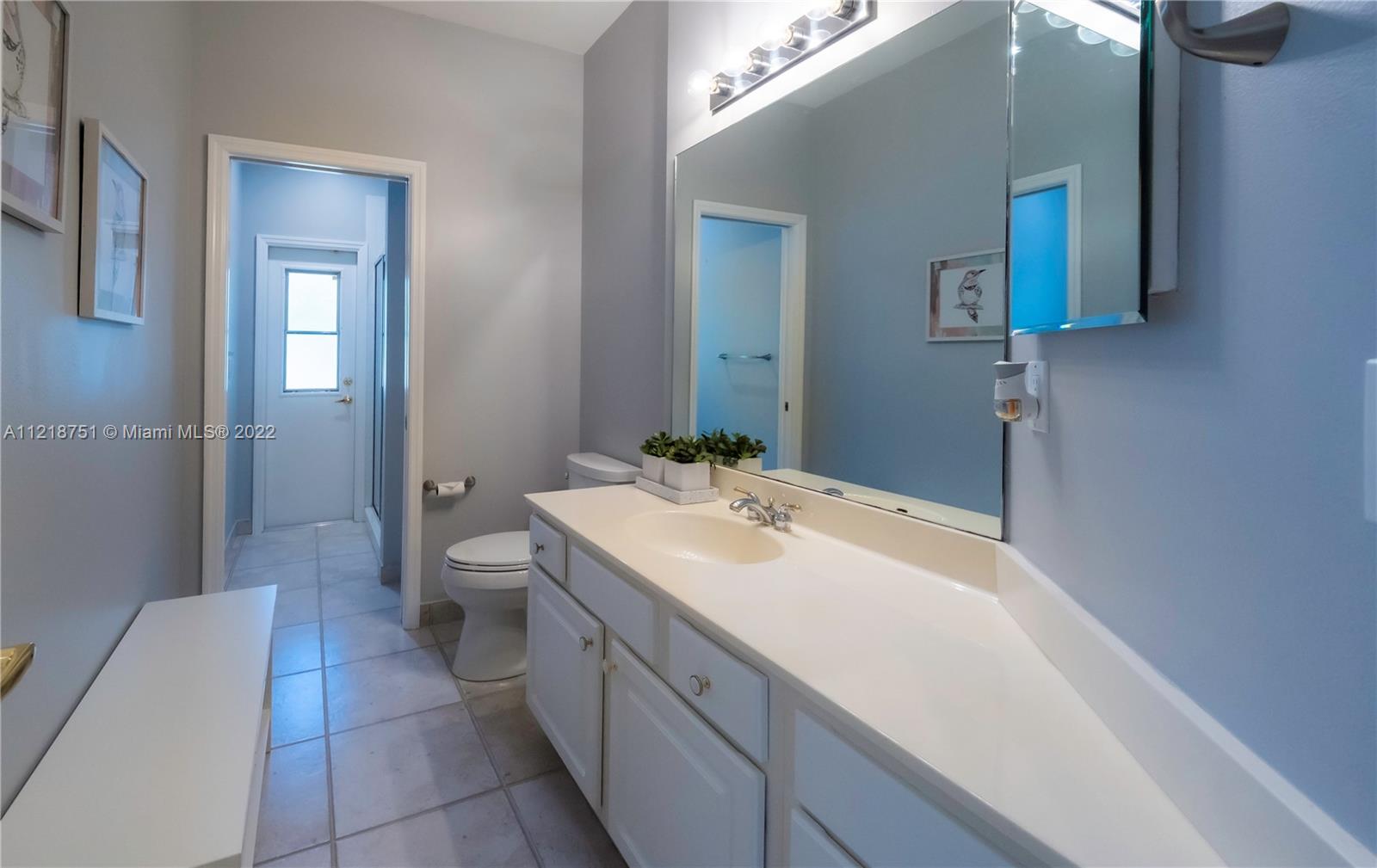 21432 Gosier Way Boca Raton, FL 33428 - Photo 38 of 55 a spacious bathroom with a sink and a mirror