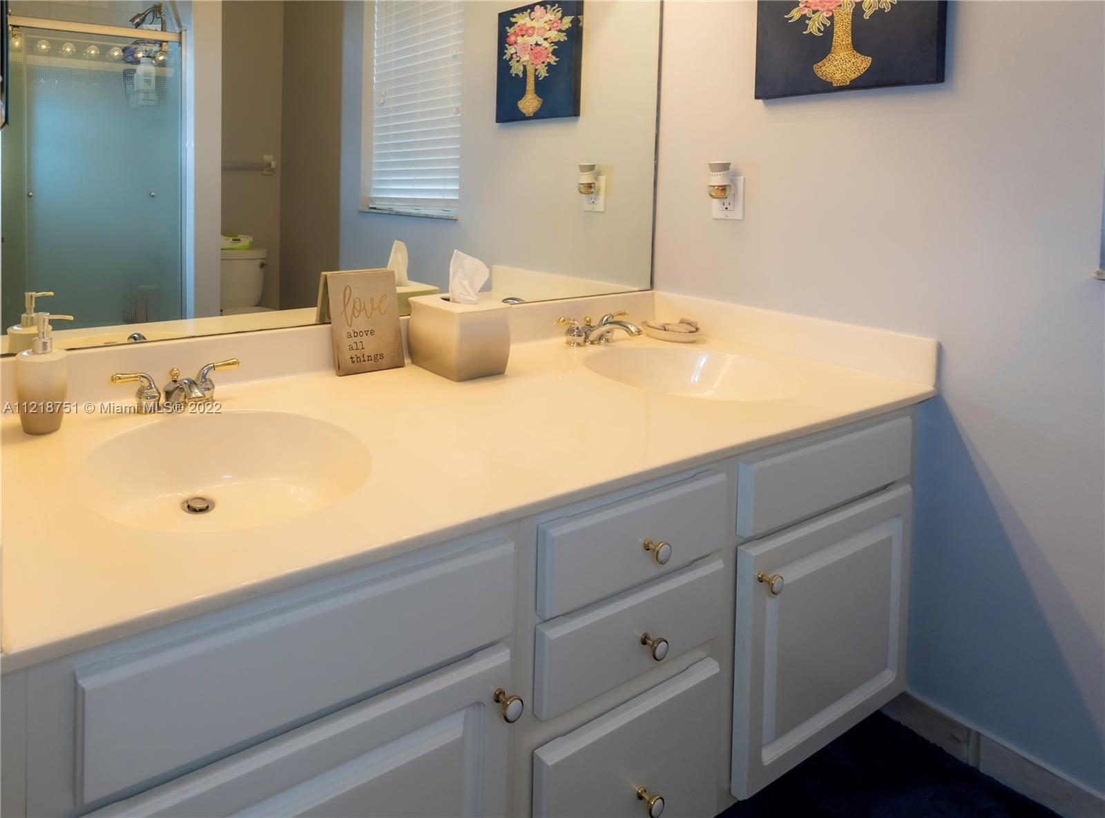 21432 Gosier Way Boca Raton, FL 33428 - Photo 40 of 55 a bathroom with a sink and a mirror