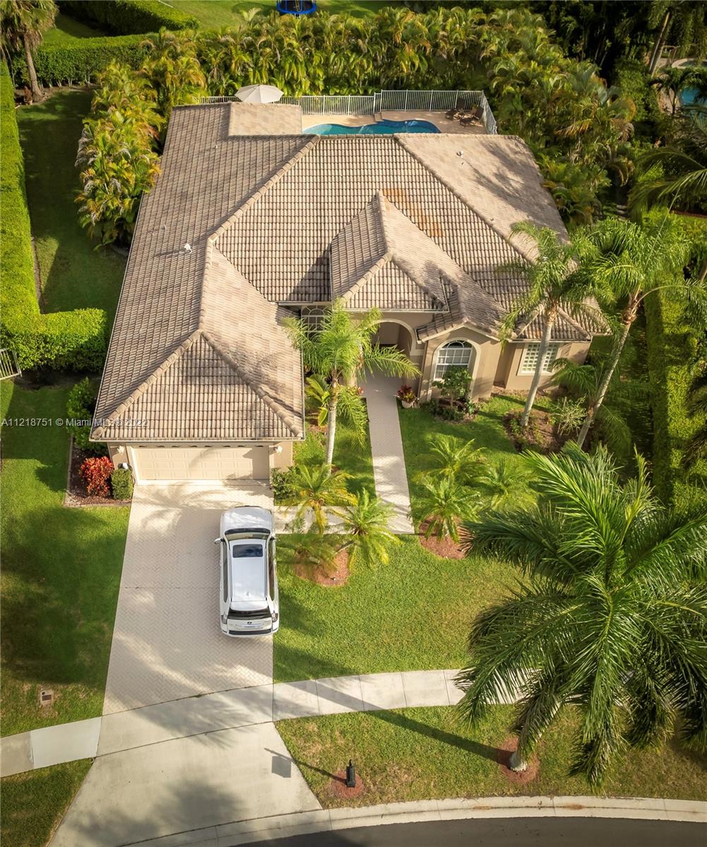 21432 Gosier Way Boca Raton, FL 33428 - Photo 4 of 55 an aerial view of a house with swimming pool and large trees