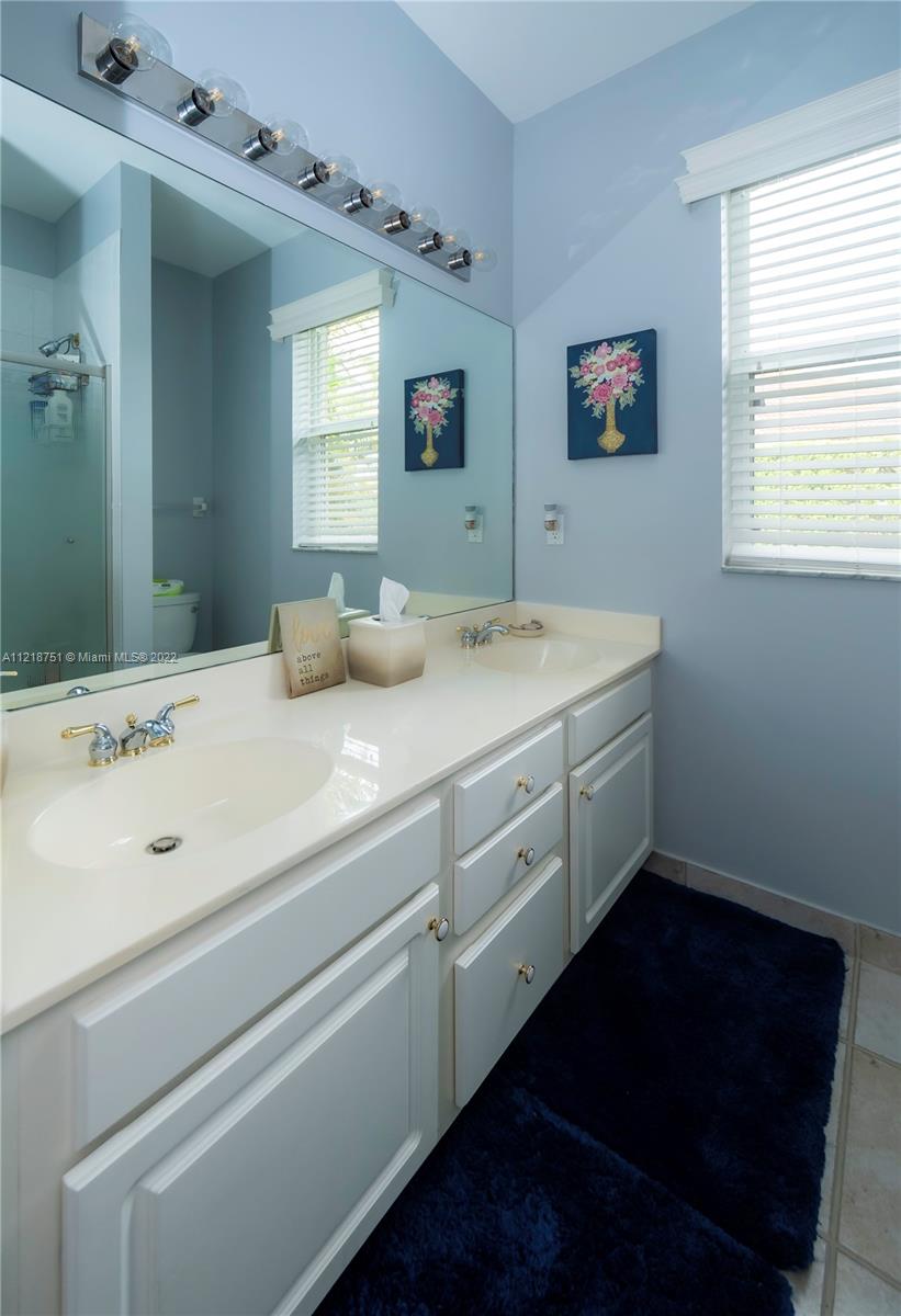 21432 Gosier Way Boca Raton, FL 33428 - Photo 41 of 55 a bathroom with a sink and a mirror