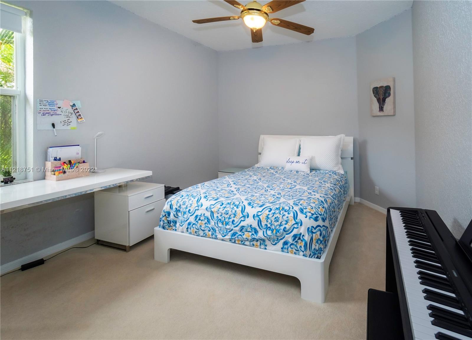 21432 Gosier Way Boca Raton, FL 33428 - Photo 42 of 55 a bedroom with a bed and a chandelier