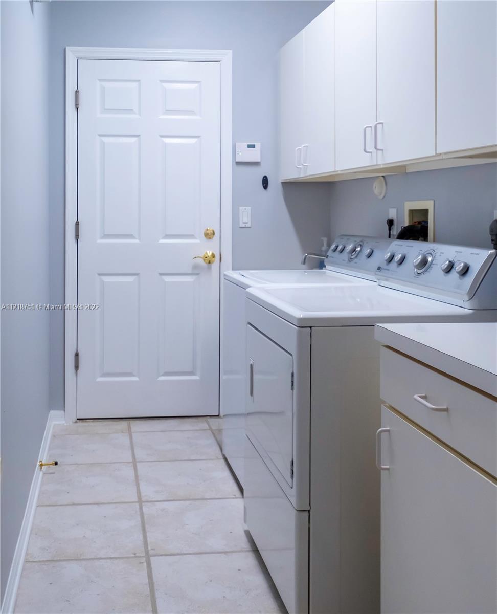 21432 Gosier Way Boca Raton, FL 33428 - Photo 43 of 55 a utility room with cabinets