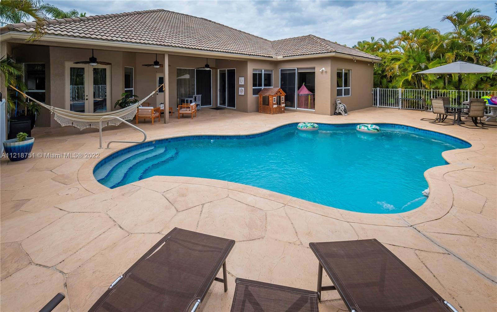21432 Gosier Way Boca Raton, FL 33428 - Photo 44 of 55 a view of a house with swimming pool and porch