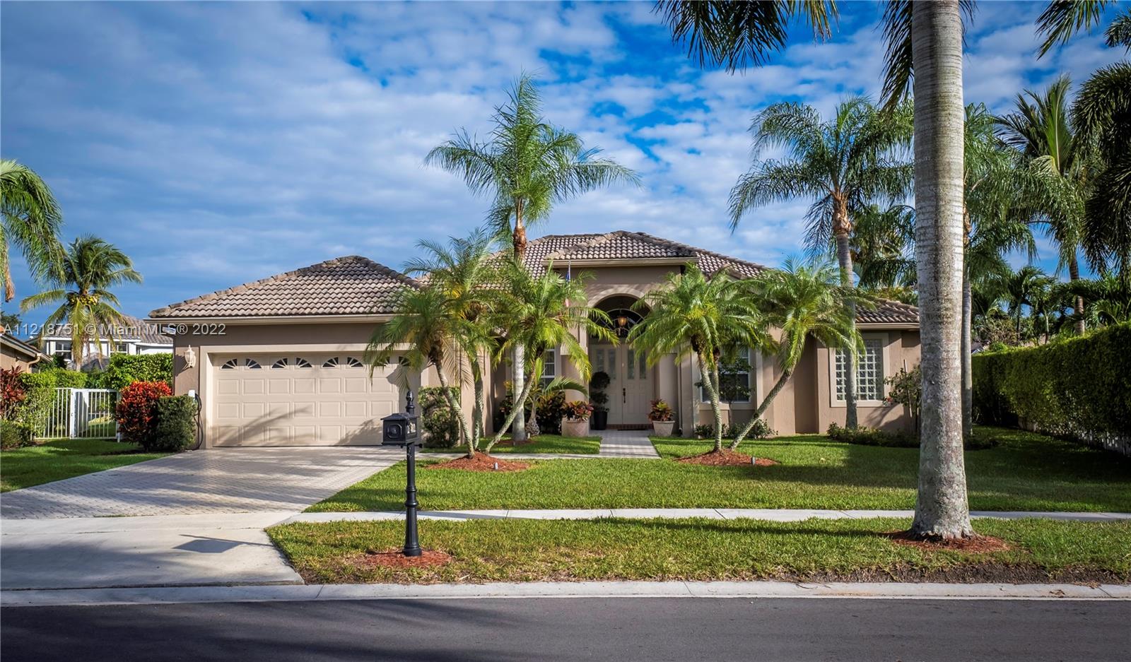 21432 Gosier Way Boca Raton, FL 33428 - Photo 5 of 55 a front view of a house with garden