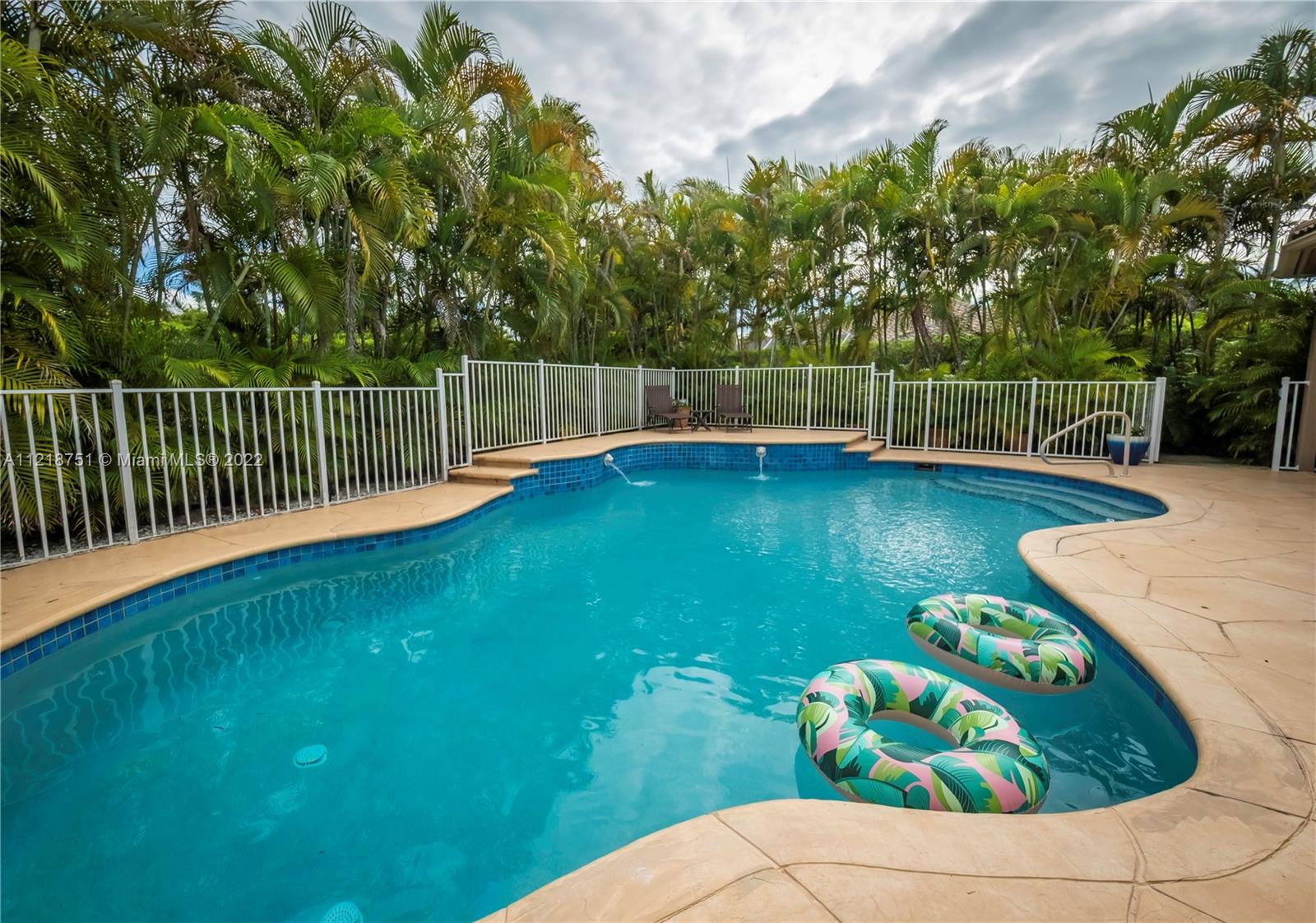 21432 Gosier Way Boca Raton, FL 33428 - Photo 51 of 55 a view of a swimming pool with a garden