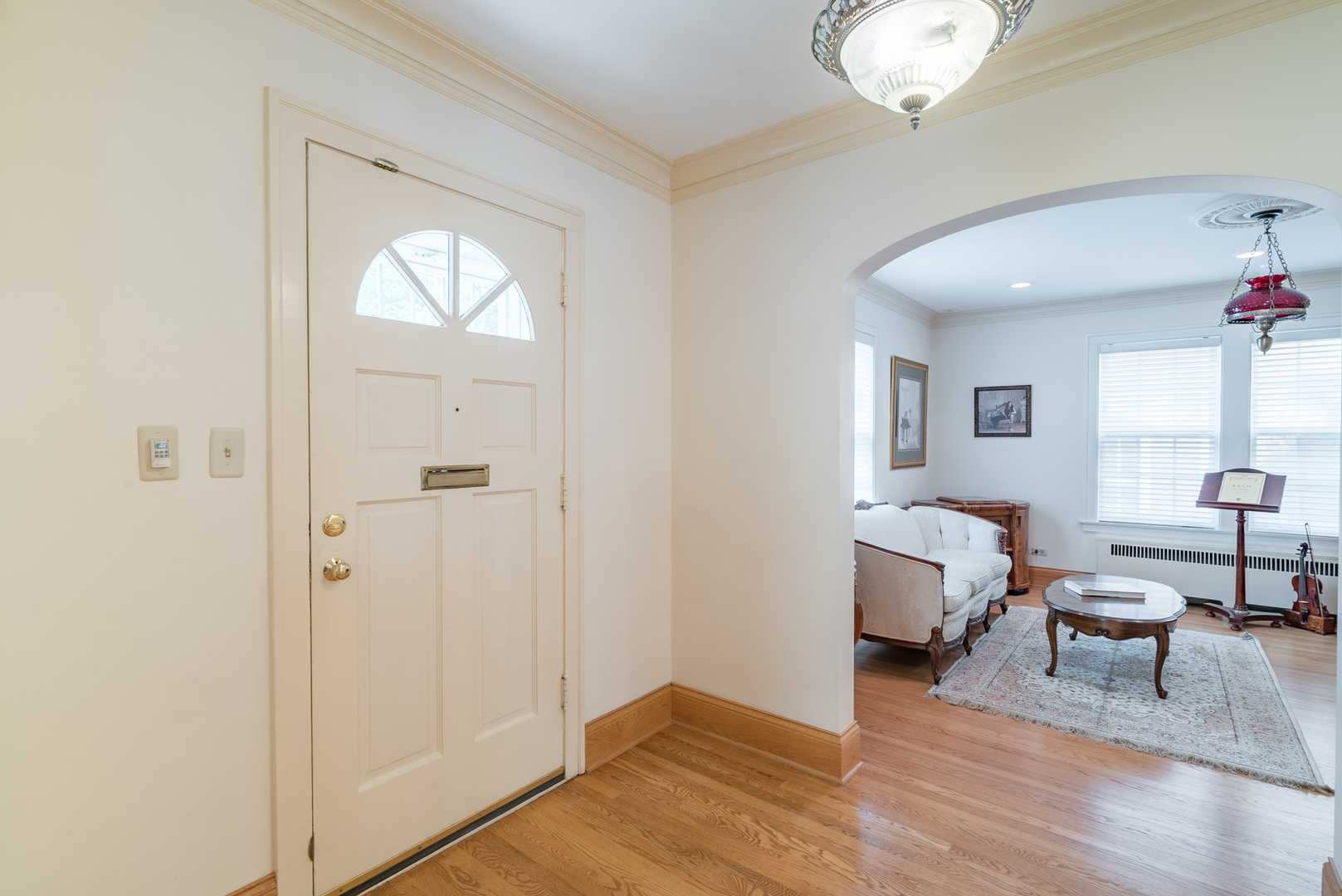 117 Elmore Street Park Ridge, IL 60068 - Photo 2 of 31 a view of a livingroom with lounge chair and a window