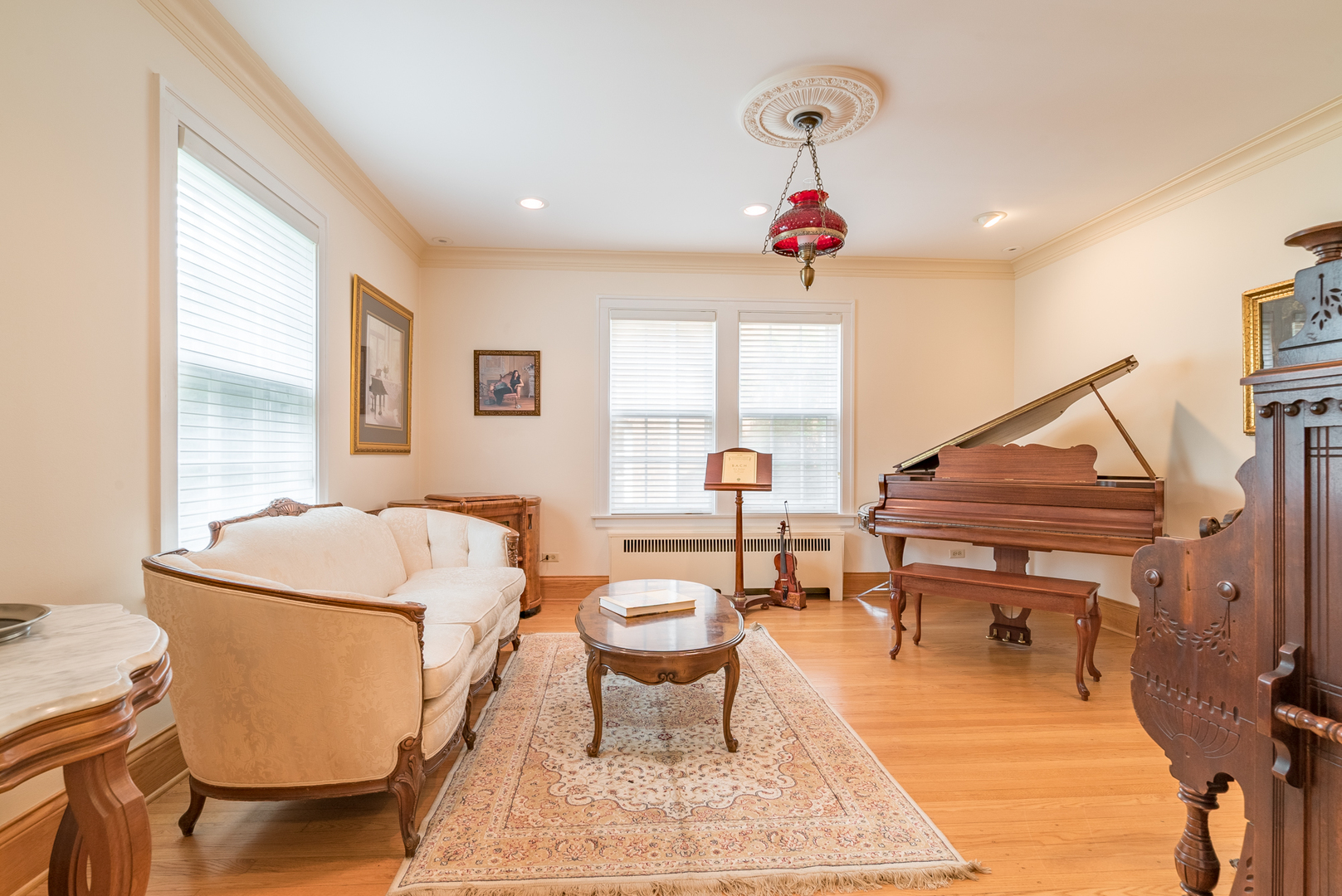 117 Elmore Street Park Ridge, IL 60068 - Photo 12 of 31 a living room with a couch and a chandelier