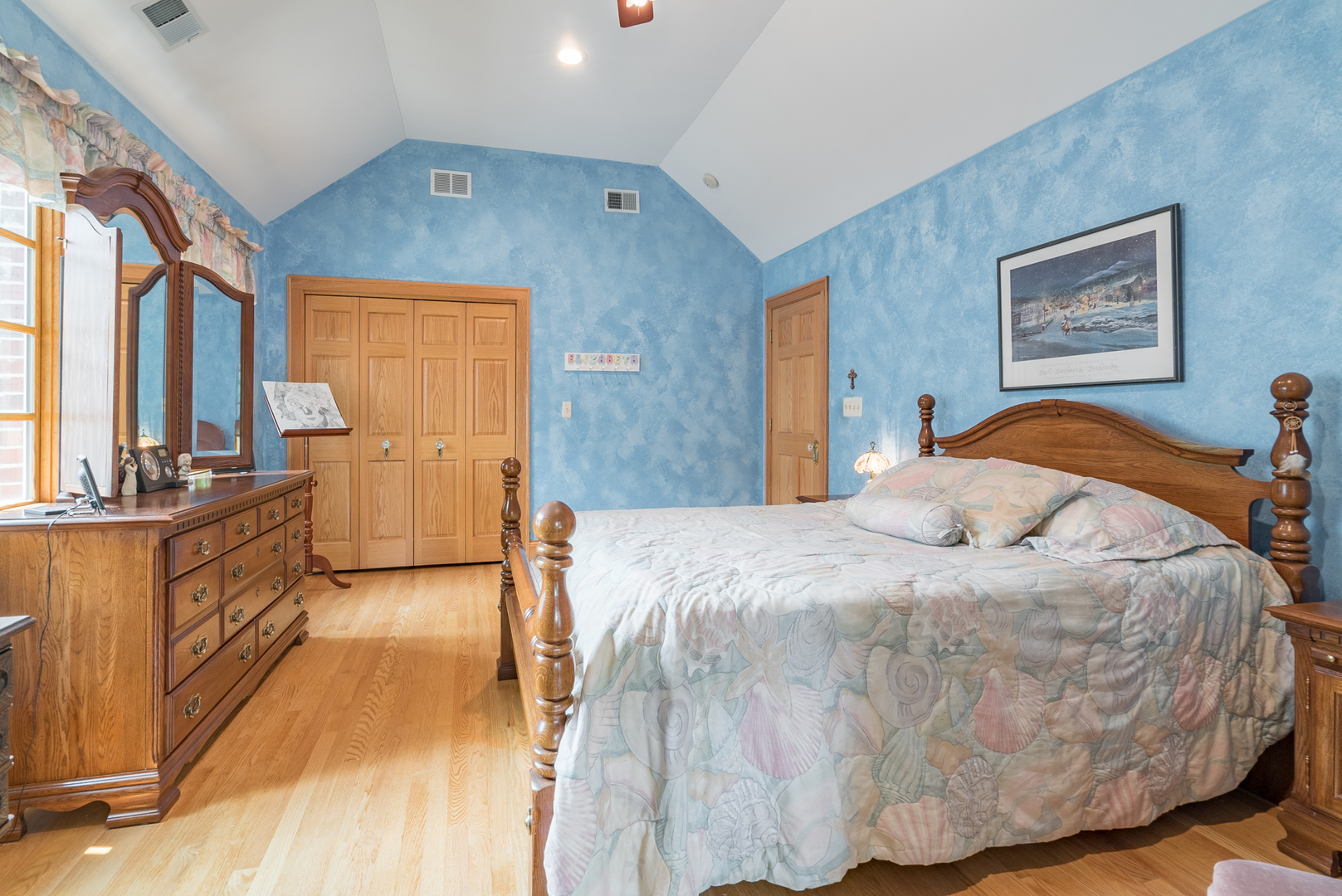 117 Elmore Street Park Ridge, IL 60068 - Photo 17 of 31 a spacious bedroom with a bed and wooden floor