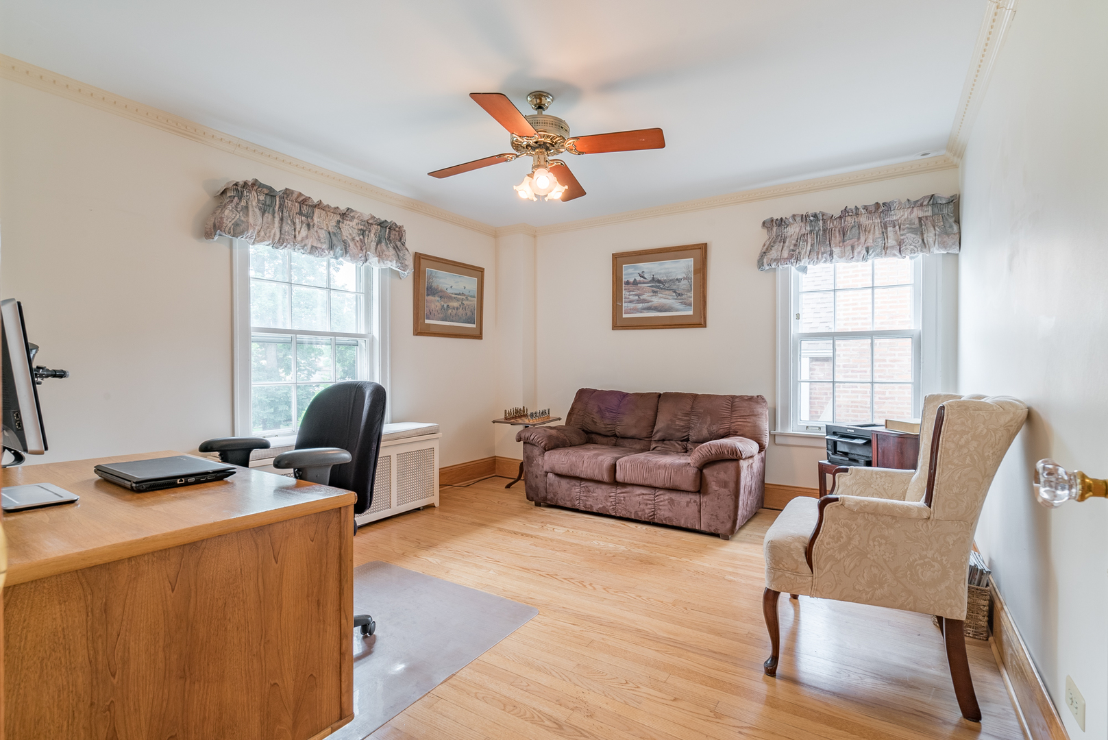 117 Elmore Street Park Ridge, IL 60068 - Photo 19 of 31 a living room with furniture ceiling fan and a window