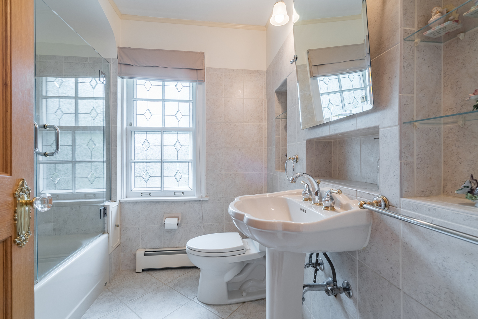 117 Elmore Street Park Ridge, IL 60068 - Photo 20 of 31 a bathroom with a sink bathtub and a toilet