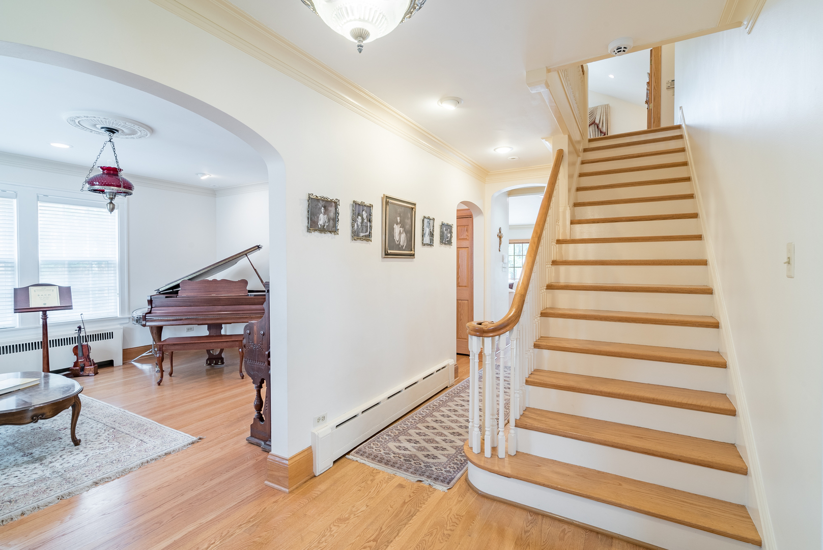 117 Elmore Street Park Ridge, IL 60068 - Photo 3 of 31 a living room with furniture and a stairs