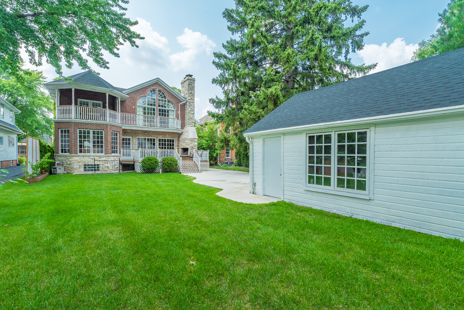 117 Elmore Street Park Ridge, IL 60068 - Photo 30 of 31 a front view of a house with a yard and trees