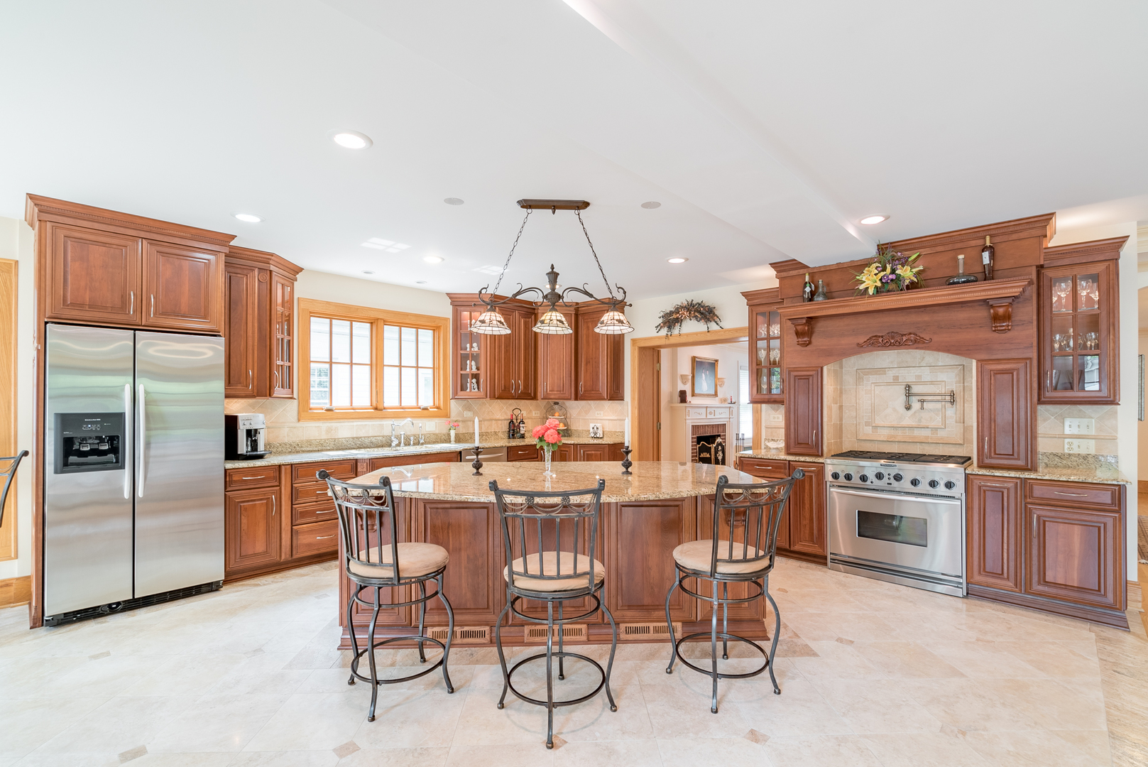 117 Elmore Street Park Ridge, IL 60068 - Photo 5 of 31 a kitchen with stainless steel appliances kitchen island granite countertop a table and chairs