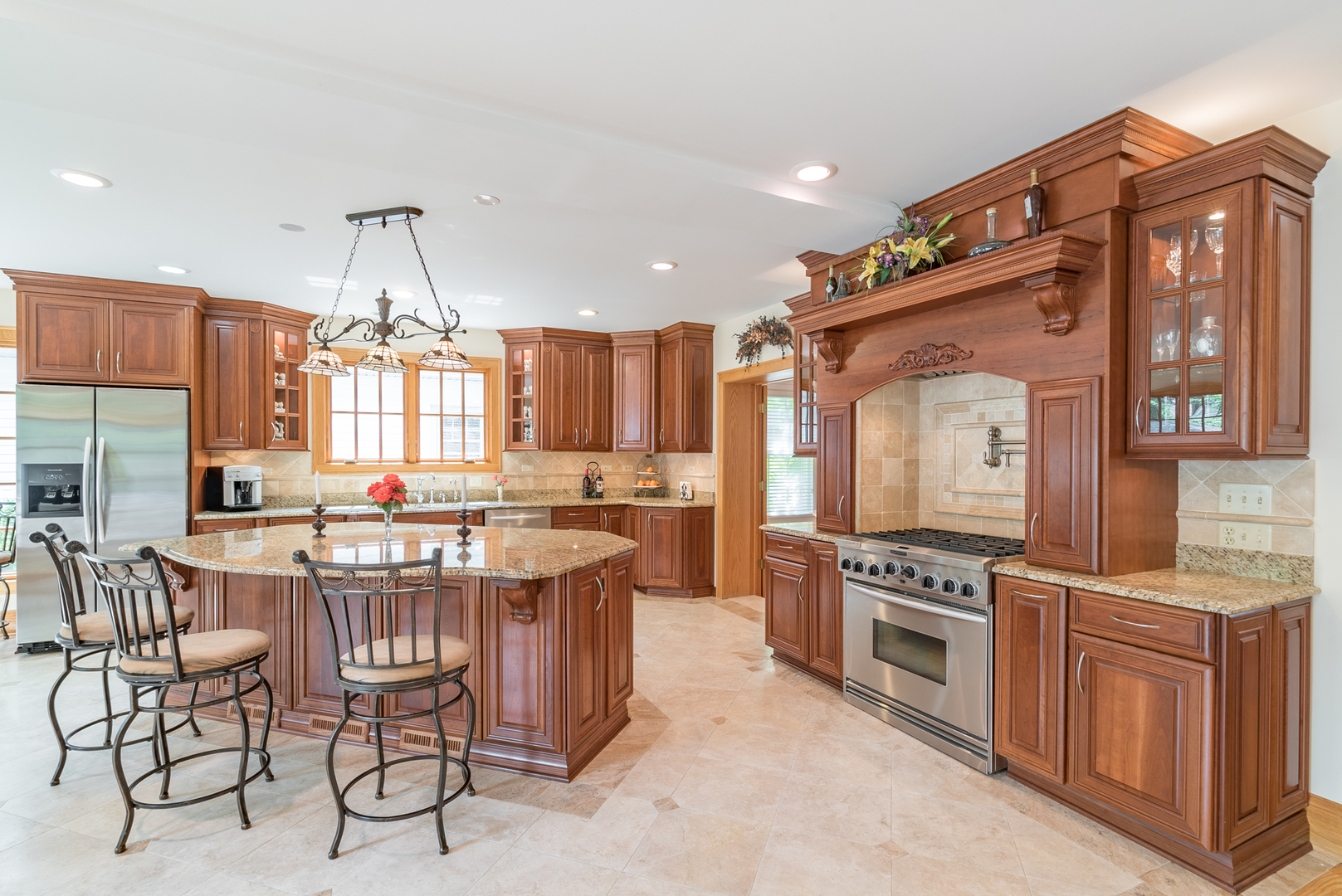 117 Elmore Street Park Ridge, IL 60068 - Photo 6 of 31 a kitchen with stainless steel appliances a stove a sink dishwasher and cabinets with wooden floor